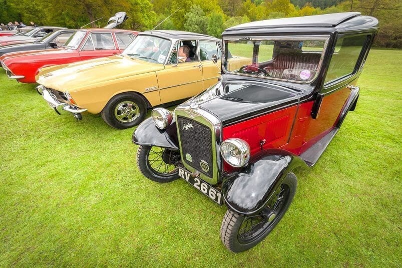 vintage car with black and silver numberplate on display at car meet