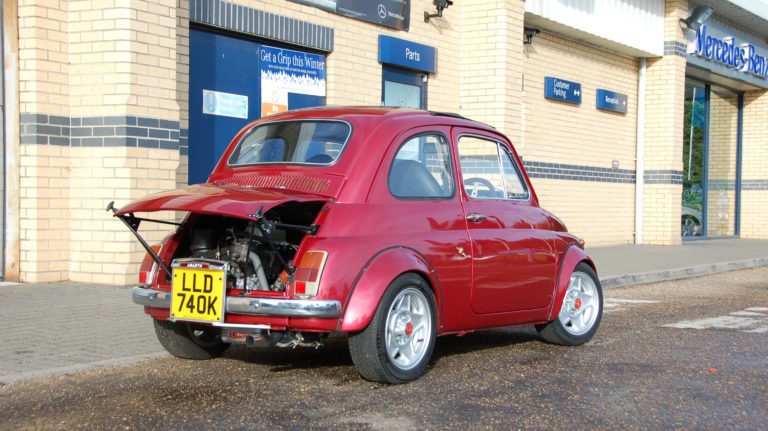 Rear view of red replica Abarth 695