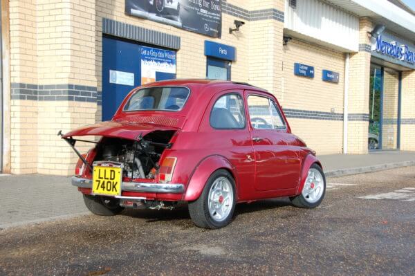Rear view of red replica Abarth 695 