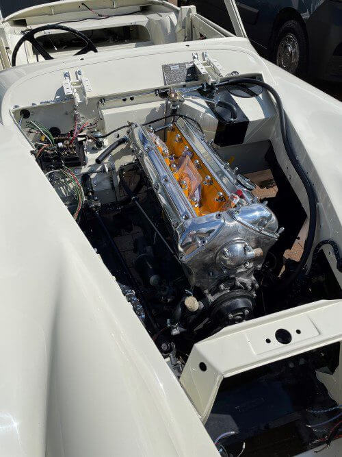 Engine bay view of Graham's white Jaguar XK 150S